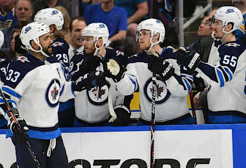 ST. LOUIS, MO – APRIL 20: Winnipeg Jets defenseman Dustin Byfuglien (33) is congratulated by teammates after scoring in the third period during a first-round Stanley Cup Playoffs game between the Winnipeg Jets and the St. Louis Blues, on April 20, 2019, at Enterprise Center, St. Louis, Mo. (Photo by Keith Gillett/Icon Sportswire via Getty Images)