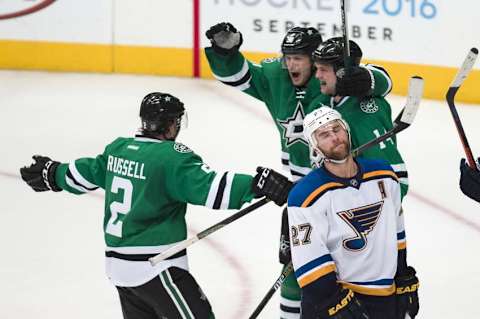 Mar 12, 2016; Dallas, TX, USA; Dallas Stars defenseman Kris Russell (2) and left wing Jamie Benn (14) and center Jason Spezza (90) celebrate Benn