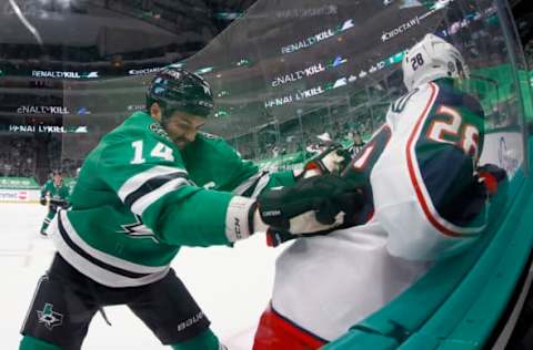 DALLAS, TEXAS – APRIL 15: Jamie Benn #14 of the Dallas Stars checks Oliver Bjorkstrand #28 of the Columbus Blue Jackets into the glass in the first period at American Airlines Center on April 15, 2021 in Dallas, Texas. (Photo by Tom Pennington/Getty Images)