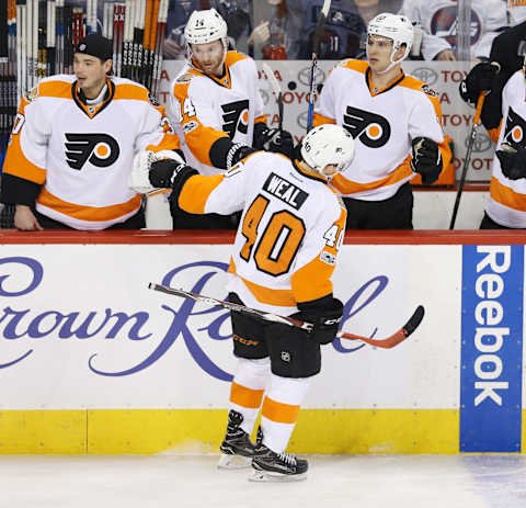 Mar 21, 2017; Winnipeg, Manitoba, CAN; Philadelphia Flyers center Jordan Weal (40) celebrates with teammates on the bench after scoring a goal during the second period against the Winnipeg Jets at MTS Centre. Mandatory Credit: Bruce Fedyck-USA TODAY Sports