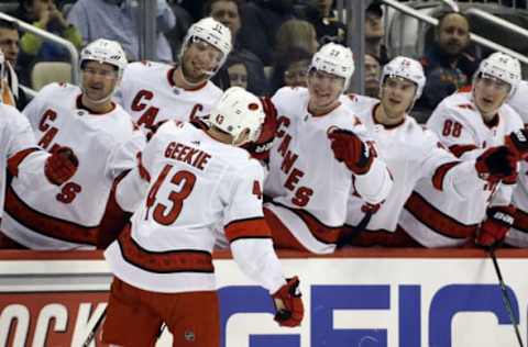 Mar 8, 2020; Pittsburgh, Pennsylvania, USA; Carolina Hurricanes center Morgan Geekie (43) receives congratulations from the bench after scoring his first NHL goal in his NHL debut against the Pittsburgh Penguins during the first period at PPG PAINTS Arena. Mandatory Credit: Charles LeClaire-USA TODAY Sports