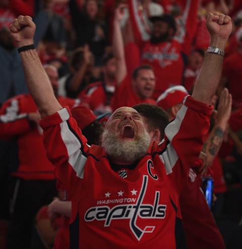 WASHINGTON, DC – MAY 23: Fans celebrate a second goal of the Washington Capitals during a free viewing party during which fans can watch the game on the jumbotron at the Capital One Arena in Washington, D.C., May 23, 2018, prior a winner-take-all game seven between the Washington Capitals and Tampa Bay Lightning. The Capitals stayed in the Stanley Cup competition by winning in game six. (Astrid Riecken For The Washington Post via Getty Images)