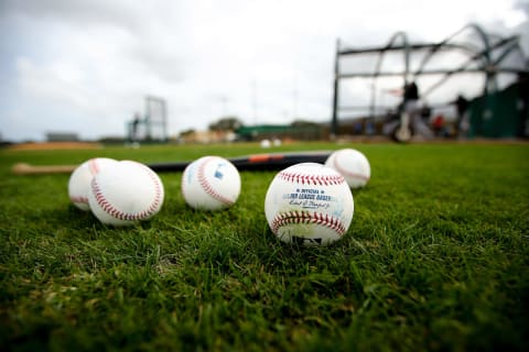 JUPITER, FL – FEBRUARY 23: Baseballs and a bat sit on the field during a Miami Marlins workout on February 23, 2016 in Jupiter, Florida. (Photo by Rob Foldy/Getty Images)