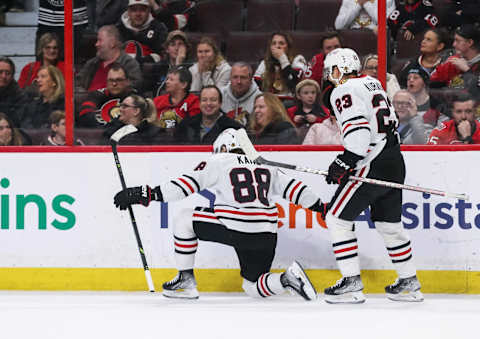 OTTAWA, CANADA – FEBRUARY 17: Patrick Kane #88 of the Chicago Blackhawks celebrates his third-period goal with teammate Philipp Kurashev #23 during the game against the Ottawa Senators at Canadian Tire Centre on February 17, 2023 in Ottawa, Ontario, Canada. (Photo by Chris Tanouye/Freestyle Photography/Getty Images)