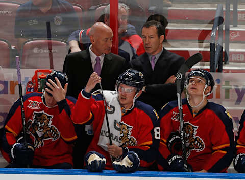 SUNRISE, FL – OCTOBER 25: Head coach Kevin Dineen talks to assistant coach Craig Ramsay of the Florida Panthers during third period action against the Buffalo Sabres at the BB&T Center on October 25, 2013 in Sunrise, Florida. The Sabres defeated the Panthers 3-1. (Photo by Joel Auerbach/Getty Images)