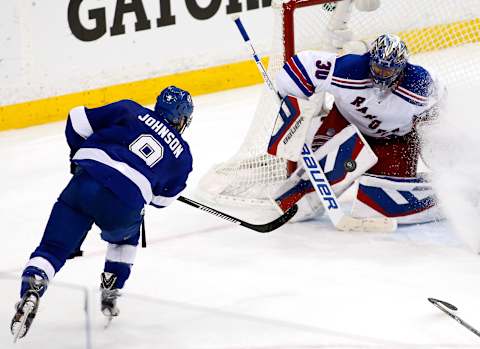 Tyler Johnson #9 of the Tampa Bay Lightning takes a shot on Henrik Lundqvist #30 of the New York Rangers (Photo by Brian Blanco/Getty Images)