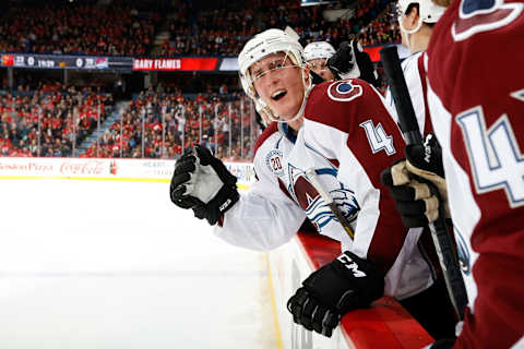 CALGARY, AB – MARCH 18: Tyson Barrie #4 of the Colorado Avalanche celebrates a shootout goal from the bench against the Calgary Flames during an NHL game at Scotiabank Saddledome on March 18, 2016 in Calgary, Alberta, Canada. (Photo by Gerry Thomas/NHLI via Getty Images)