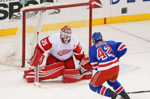 NEW YORK, NY – MARCH 19: Detroit Red Wings Goalie Jimmy Howard (35) deflects a one on one shot by New York Rangers Defenceman Brendan Smith (42) during the second period of the National Hockey League game between the Detroit Red Wings and the New York Rangers on March 19, 2019 at Madison Square Garden in New York, NY. (Photo by Joshua Sarner/Icon Sportswire via Getty Images)