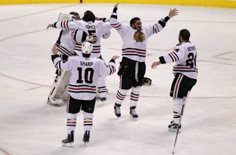 The Chicago Blackhawks celebrate after teammate Patrick Kane #88 scored (Photo by Al Bello/Getty Images)