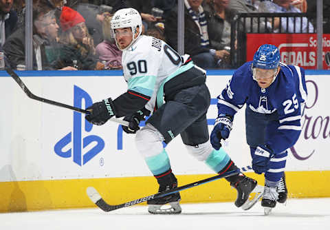 TORONTO, ON – MARCH 8: Marcus Johansson #90 of the Seattle Kraken skates against Ondrej Kase #25 of the Toronto Maple Leafs  (Photo by Claus Andersen/Getty Images)