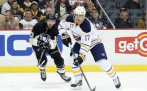 Mar 29, 2016; Pittsburgh, PA, USA; Buffalo Sabres center David Legwand (17) moves the puck against pressure from Pittsburgh Penguins center Nick Bonino (13) during the third period at the CONSOL Energy Center. The Penguins won 5-4 in a shootout. Mandatory Credit: Charles LeClaire-USA TODAY Sports