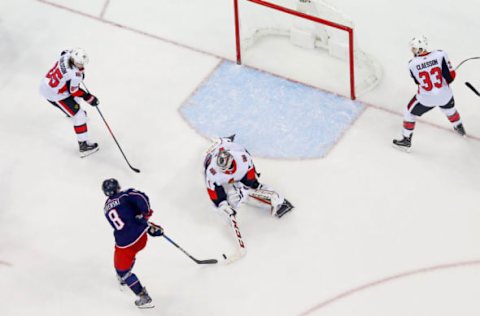 COLUMBUS, OH – MARCH 17: Mike Condon #1 of the Ottawa Senators knocks the puck away from Zach Werenski #8 of the Columbus Blue Jackets during the game on March 17, 2018 at Nationwide Arena in Columbus, Ohio. Columbus defeated Ottawa 2-1. (Photo by Kirk Irwin/Getty Images) *** Local Caption *** Mike Condon;Zach Werenski