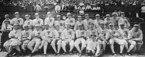 (Original Caption) Remarkable Group Photograph of the Chicago White Sox, Champions of the American League. Expected to Contest for World Series Honors with Cincinnati Reds. Top Row, Left to Right: Roy Wilkenson, Harvey McClellan, John Sullivan, Grover Loudermilk, Byrd Lynn, Chick Gandil, Nemo Leibold, Fred McMullin, Ed Murphy, Eddie Cicotte, Swede Risberg, Red Faber. Bottom Row left to right: Ray Schalk, Joe Jenkins, Dickie Kerr, Shano Collins, Erskine Mayer, team manager William “Kid” Gleason, Eddie Collins, Buck Weaver, Happy Felsch, Joe Jackson, Bill James. Front: Sharkey, club house boy and mascot. (Photo by George Rinhart/Corbis via Getty Images)