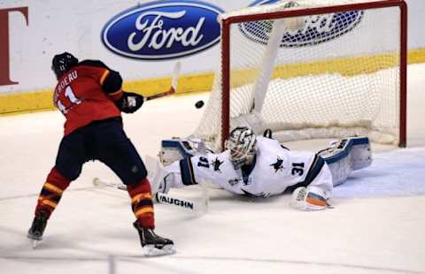 Feb 18, 2016; Sunrise, FL, USA; San Jose Sharks goalie Martin Jones (31) makes a save on a shot by Florida Panthers center Jonathan Huberdeau (11) in a shootout at BB&T Center. The Sharks won 2-1. Mandatory Credit: Robert Mayer-USA TODAY Sports