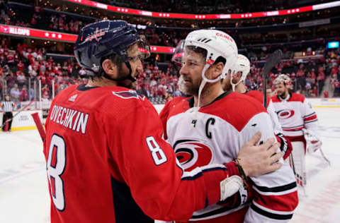 WASHINGTON, DC – APRIL 24: Alex Ovechkin #8 of the Washington Capitals and Justin Williams #14 of the Carolina Hurricanes shake hands after the Hurricanes defeated the Capitals 4-3 in the second overtime period in Game Seven of the Eastern Conference First Round during the 2019 NHL Stanley Cup Playoffs at Capital One Arena on April 24, 2019 in Washington, DC. (Photo by Patrick McDermott/NHLI via Getty Images)