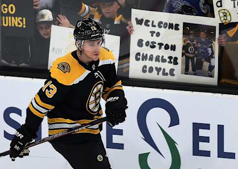 BOSTON – FEBRUARY 26: Boston Bruins’ Charlie Coyle is welcomed to Boston by a fan during pre-game warmups prior to his home debut as a member of the team. The Boston Bruins host the San Jose Sharks in a regular season NHL hockey game at TD Garden in Boston on Feb. 26, 2019. (Photo by Jim Davis/The Boston Globe via Getty Images)