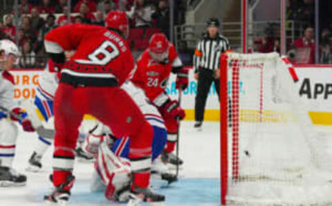 Feb 16, 2023; Raleigh, North Carolina, USA; Carolina Hurricanes center Seth Jarvis (24) scores a goal against the Montreal Canadiens during the third period at PNC Arena. Mandatory Credit: James Guillory-USA TODAY Sports