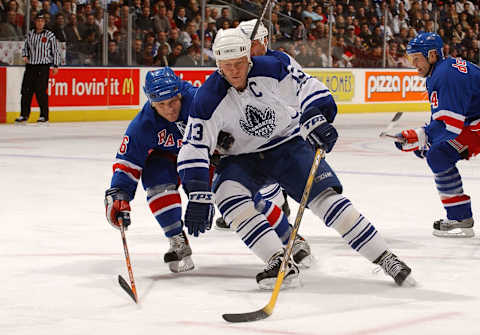 TORONTO – DECEMBER 13: Darius Kasparaitis #6 of the New York Rangers tries to stop Mats Sundin #13 of the Toronto Maple Leafs as he drives to the net with the puck during the game at Air Canada Centre on December 13, 2003 in Toronto, Ontario, Canada. (Photo By Dave Sandford/Getty Images)