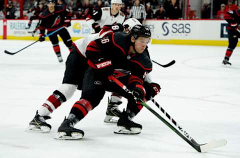 RALEIGH, NC – JANUARY 10: Erik Haula #56 of the Carolina Hurricanes and Nick Schmaltz #8 of the Arizona Coyotes battle during an NHL game on January 10, 2020 at PNC Arena in Raleigh, North Carolina. (Photo by Gregg Forwerck/NHLI via Getty Images)