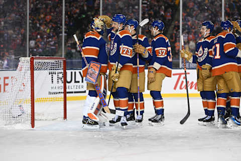 Oct 29, 2023; Edmonton, Alberta, CAN; Oilers goalie Stuart Skinner (74) along with Oilers defenceman Vincent Desharnais (73) celebrate their win in the third period in the 2023 Heritage Classic ice hockey game at Commonwealth Stadium. Mandatory Credit: Walter Tychnowicz-USA TODAY Sports