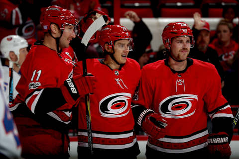 RALEIGH, NC – NOVEMBER 19: Sebastian Aho #20 of the Carolina Hurricanes celebrates with teammates after scoring a goal during an NHL game against the New York Islanders on November 19, 2017 at PNC Arena in Raleigh, North Carolina. (Photo by Gregg Forwerck/NHLI via Getty Images)