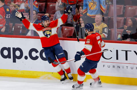 Mar 7, 2023; Sunrise, Florida, USA; Florida Panthers left wing Ryan Lomberg (94) celebrates with defenseman Radko Gudas (7) after scoring during the first period against the Vegas Golden Knights at FLA Live Arena. Mandatory Credit: Sam Navarro-USA TODAY Sports