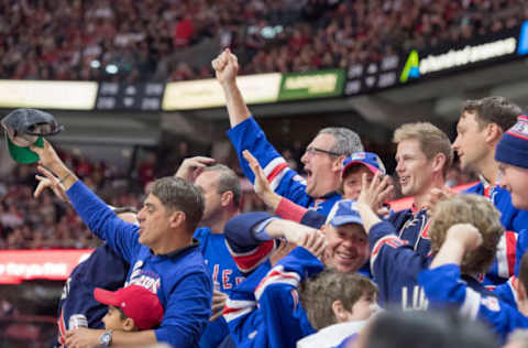 Apr 29, 2017; Ottawa, Ontario, CAN; New York Rangers fans celebrate a goal scored by their team in the second period of game two in the second round of the 2017 Stanley Cup Playoffs against Ottawa Senators at the Canadian Tire Centre. Mandatory Credit: Marc DesRosiers-USA TODAY Sports