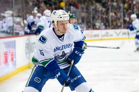 Dec 15, 2015; Saint Paul, MN, USA; Vancouver Canucks forward Derek Dorsett (15) skates with the puck in the second period against the Minnesota Wild at Xcel Energy Center. Mandatory Credit: Brad Rempel-USA TODAY Sports