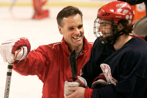 WORCESTER, MA – MARCH 23: Boston University Associate Head Coach David Quinn talks with player Dan Spang during practice at the DCU Center. (Photo by Bill Greene/The Boston Globe via Getty Images)