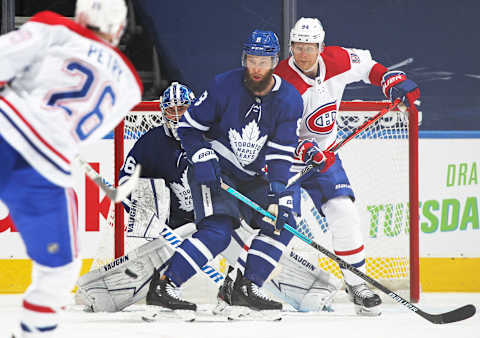 TORONTO, ON – APRIL 7: Corey Perry #94 of the Montreal Canadiens watches an incoming shot against Jake Muzzin #8 and Jack Campbell #36 of the Toronto Maple Leafs   (Photo by Claus Andersen/Getty Images)