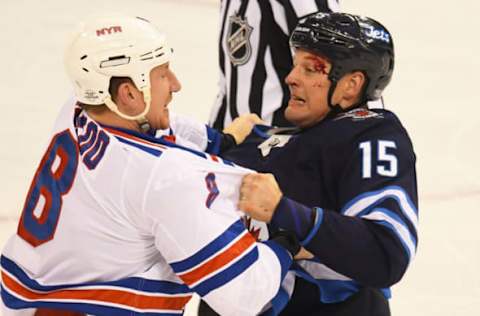 WINNEPEG, MB – FEBRUARY 11: Winnipeg Jets Center Matt Hendricks (15) and New York Rangers Left Wing Cody McLeod (8) fight in the 2nd period during a NHL game between the Winnipeg Jets and New York Rangers on February 11, 2018 at Bell MTS Centre in Winnepeg, MB. The Rangers defeated the Jets 3-1.(Photo by Nick Wosika/Icon Sportswire via Getty Images)