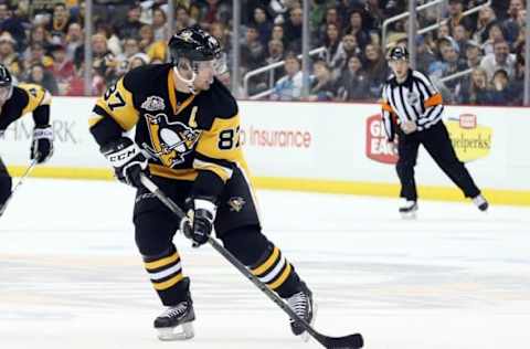 Dec 31, 2016; Pittsburgh, PA, USA; Pittsburgh Penguins center Sidney Crosby (87) skates with the puck against the Montreal Canadiens during the third period at the PPG PAINTS Arena. The Pens won 4-3 in overtime. Mandatory Credit: Charles LeClaire-USA TODAY Sports