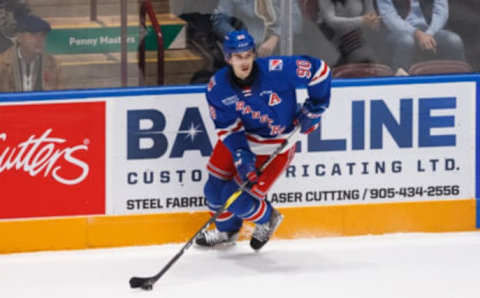 OSHAWA, ON – NOVEMBER 10: Liam Hawel #90 of the Kitchener Rangers skates with the puck during an OHL game against the Oshawa Generals at the Tribute Communities Centre on November 10, 2019 in Oshawa, Ontario, Canada. (Photo by Chris Tanouye/Getty Images)