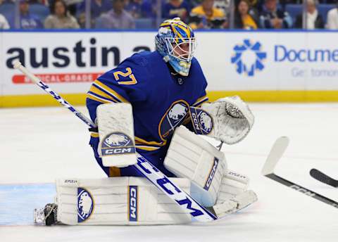 Oct 6, 2023; Buffalo, New York, USA; Buffalo Sabres goaltender Devon Levi (27) looks for the puck during the third period against the Pittsburgh Penguins at KeyBank Center. Mandatory Credit: Timothy T. Ludwig-USA TODAY Sports