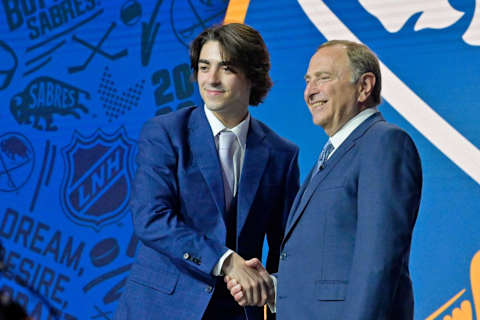 Jul 7, 2022; Montreal, Quebec, CANADA; Matthew Savoie shakes hands with NHL commissioner Gary Bettman after being selected as the number nine overall pick to the Buffalo Sabres in the first round of the 2022 NHL Draft at Bell Centre. Mandatory Credit: Eric Bolte-USA TODAY Sports