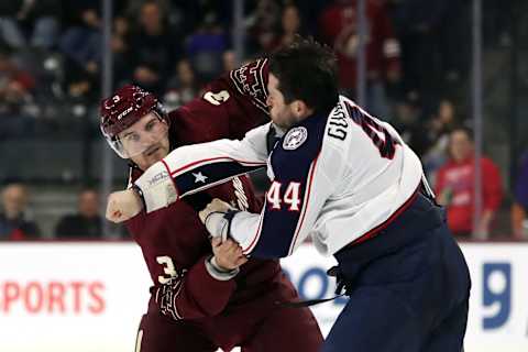 TEMPE, ARIZONA – FEBRUARY 19: Josh Brown #3 of the Arizona Coyotes and Erik Gudbranson #44 of the Columbus Blue Jackets fight at the beginning of the second period at Mullett Arena on February 19, 2023 in Tempe, Arizona. (Photo by Zac BonDurant/Getty Images)