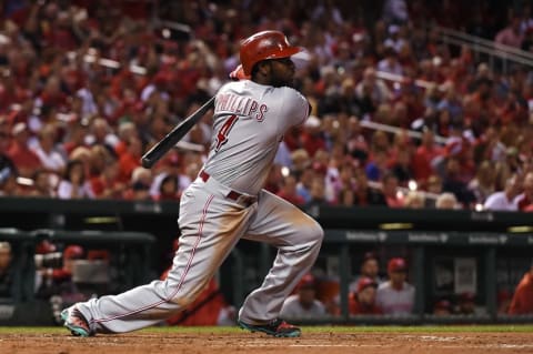 Sep 26, 2016; St. Louis, MO, USA; Cincinnati Reds second baseman Brandon Phillips (4) hits a two-run single off of St. Louis Cardinals relief pitcher Michael Wacha (not pictured) during the fourth inning at Busch Stadium. Mandatory Credit: Jeff Curry-USA TODAY Sports