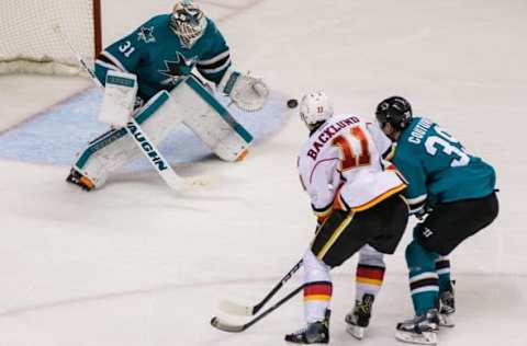 Dec 20, 2016; San Jose, CA, USA; Calgary Flames center Mikael Backlund (11) shoots against in the third period at SAP Center at San Jose. The Sharks won 4-1. Mandatory Credit: John Hefti-USA TODAY Sports