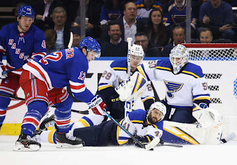 NEW YORK, NEW YORK – MARCH 03: Robert Bortuzzo #41 of the St. Louis Blues dives in front of a shot by Julien Gauthier #12 of the New York Rangers during their game at Madison Square Garden on March 03, 2020 in New York City. (Photo by Al Bello/Getty Images)