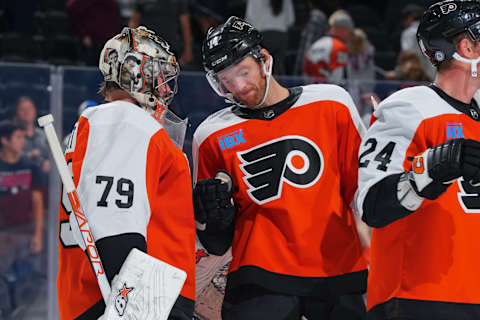 PHILADELPHIA, PENNSYLVANIA – OCTOBER 5: Carter Hart #79 of the Philadelphia Flyers celebrates with Sean Couturier #14 in the preseason game against the New York Islanders at the Wells Fargo Center on October 5, 2023 in Philadelphia, Pennsylvania. The Flyers defeated the Islanders 5-2. (Photo by Mitchell Leff/Getty Images)