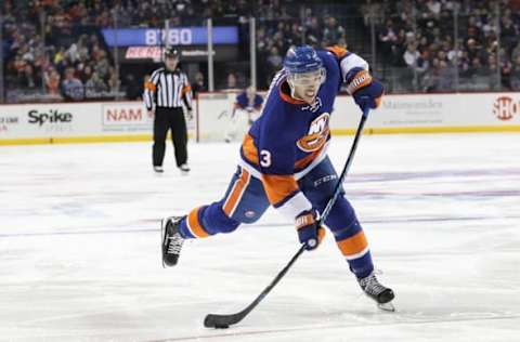 NHL Trade Rumors: New York Islanders defenseman Travis Hamonic (3) shoots on goal during the second period against the Washington Capitals at Barclays Center. Mandatory Credit: Anthony Gruppuso-USA TODAY Sports