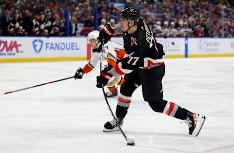 Jan 21, 2023; Buffalo, New York, USA; Buffalo Sabres right wing JJ Peterka (77) takes a shot on goal during the second period against the Anaheim Ducks at KeyBank Center. Mandatory Credit: Timothy T. Ludwig-USA TODAY Sports