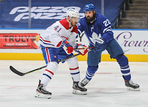 TORONTO, ON – MAY 31: Paul Byron #41 of the Montreal Canadiens is tied up by Zach Bogosian #22 of the Toronto Maple Leafs  . (Photo by Claus Andersen/Getty Images)