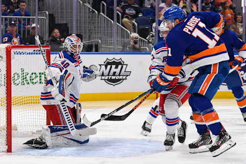 Apr 21, 2022; Elmont, New York, USA; New York Rangers defenseman Adam Fox (23) and New York Islanders left wing Zach Parise (11) battle for a loose puck in front of New York Rangers goaltender Alexandar Georgiev (40) during the second period at UBS Arena. Mandatory Credit: Dennis Schneidler-USA TODAY Sports