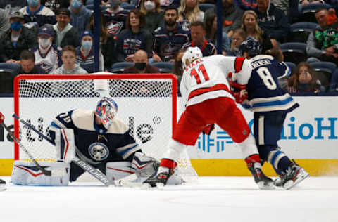 COLUMBUS, OH – OCTOBER 23: Jordan Staal #11 of the Carolina Hurricanes knocks the puck past Joonas Korpisalo #70 of the Columbus Blue Jackets for a goal during the second period at Nationwide Arena on October 23, 2021, in Columbus, Ohio. (Photo by Kirk Irwin/Getty Images)