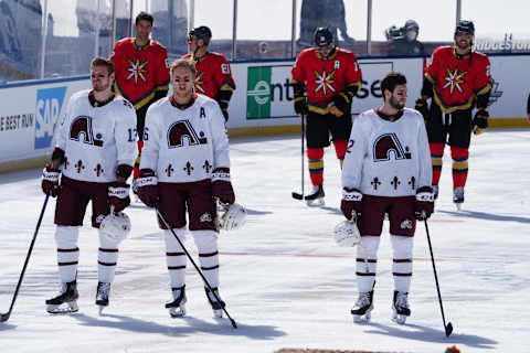 Feb 20, 2021; Stateline, NV, USA; Colorado Avalanche and Vegas Golden Knights players line up during the playing of the national anthem before a NHL Outdoors hockey game at Lake Tahoe. Mandatory Credit: Kirby Lee-USA TODAY Sports