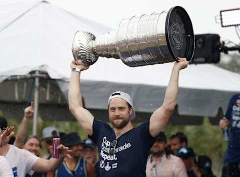 Jul 12, 2021; Tampa, FL, USA; Tampa Bay Lightning defenseman Victor Hedman (77) hoists the Stanley Cup during the Stanley Cup Championship parade. Mandatory Credit: Kim Klement-USA TODAY Sports