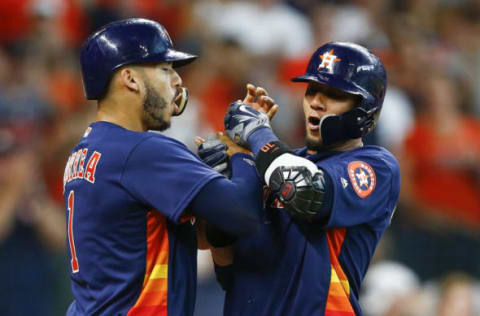 HOUSTON, TX – JUNE 24: Yuli Gurriel #10 of the Houston Astros celebrates with Carlos Correa #1 after Gurriel’s grand slam in the second inning against the Kansas City Royals at Minute Maid Park on June 24, 2018 in Houston, Texas. (Photo by Bob Levey/Getty Images)