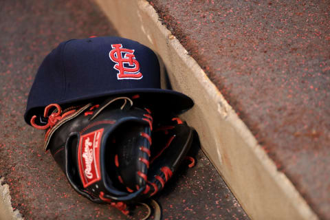 ANAHEIM, CA – MAY 10: A detail photo of a St. Louis Cardinals hat and glove during a baseball game between the Los Angeles Angels of Anaheim and the St. Louis Cardinals at Angel Stadium of Anaheim on May 10, 2016 in Anaheim, California. The St. Louis Cardinals defeated the Los Angeles Angels of Anaheim 8-1. (Photo by Sean M. Haffey/Getty Images)