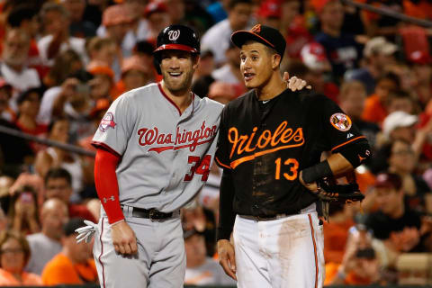 BALTIMORE, MD – JULY 10: Bryce Harrper #34 of the Washington Nationals and Mannny Machado #13 of the Baltimore Orioles talk during their game at Oriole Park at Camden Yards on July 10, 2015 in Baltimore, Maryland. (Photo by Rob Carr/Getty Images)